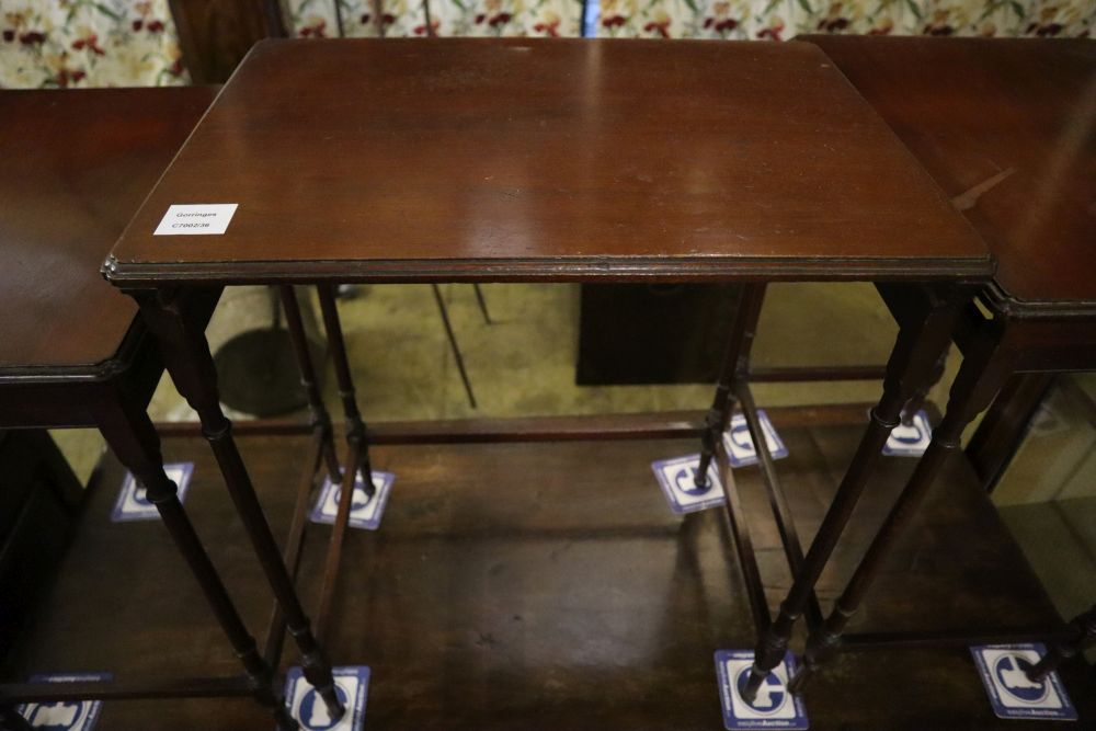 An Edwardian nest of three mahogany tea tables, width 51cm depth 36cm height 61cm